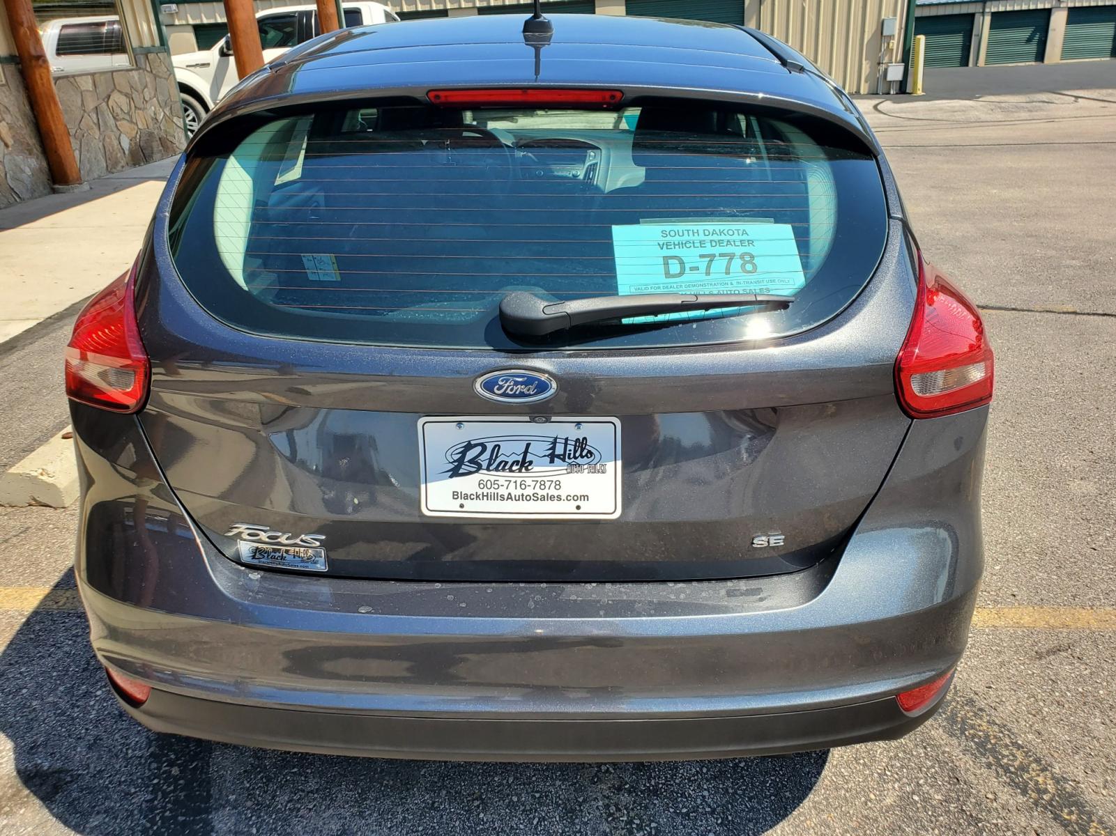 2016 Tan /Black Ford Focus SE (1FADP3F23GL) with an 2.0L 4Cyl GDI TI-VCT engine, 6-Speed Powershift Automatic transmission, located at 1600 E Hwy 44, Rapid City, SD, 57703, (605) 716-7878, 44.070232, -103.171410 - Photo #33